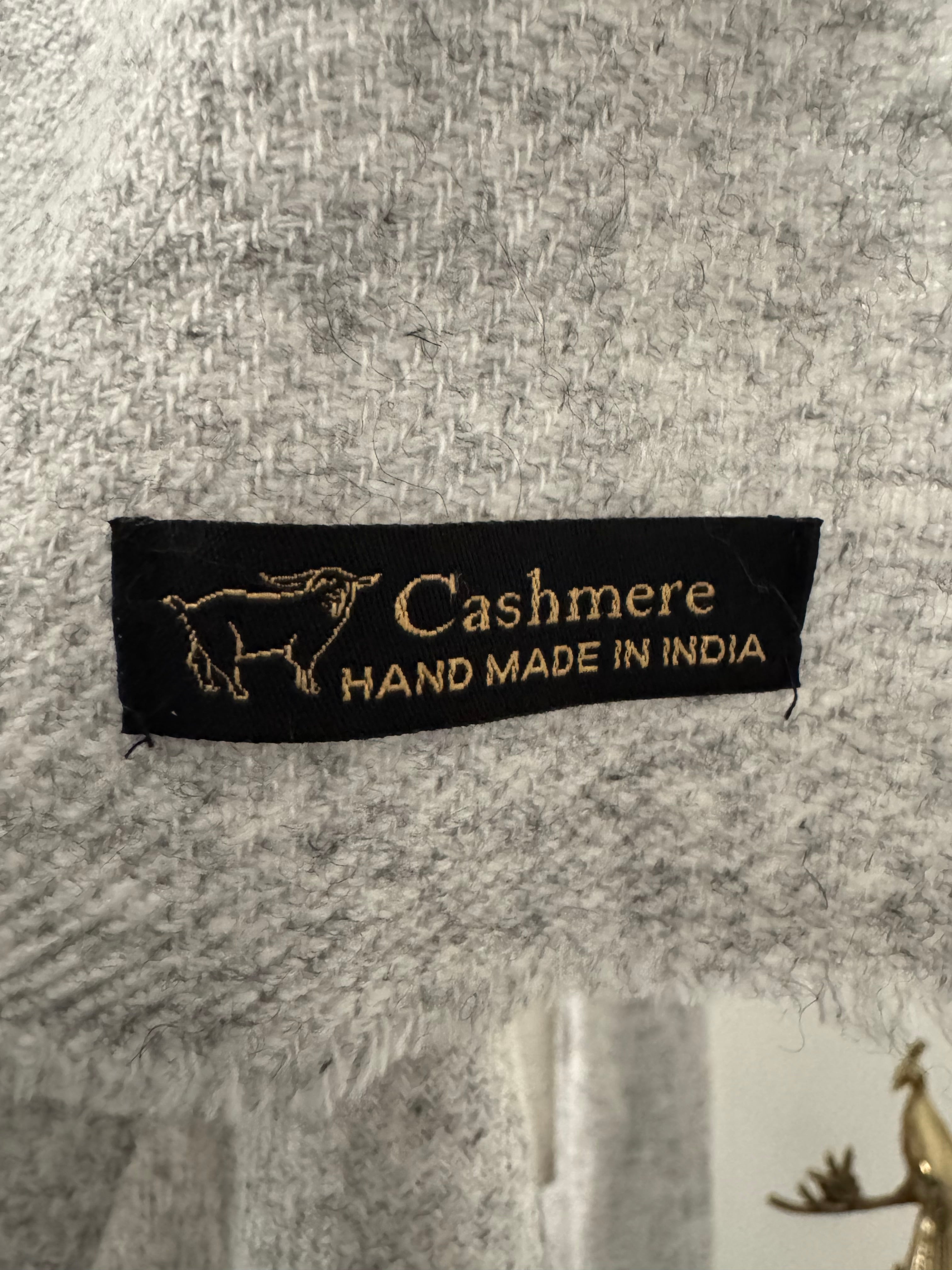 Cashmere label on a textured fabric background