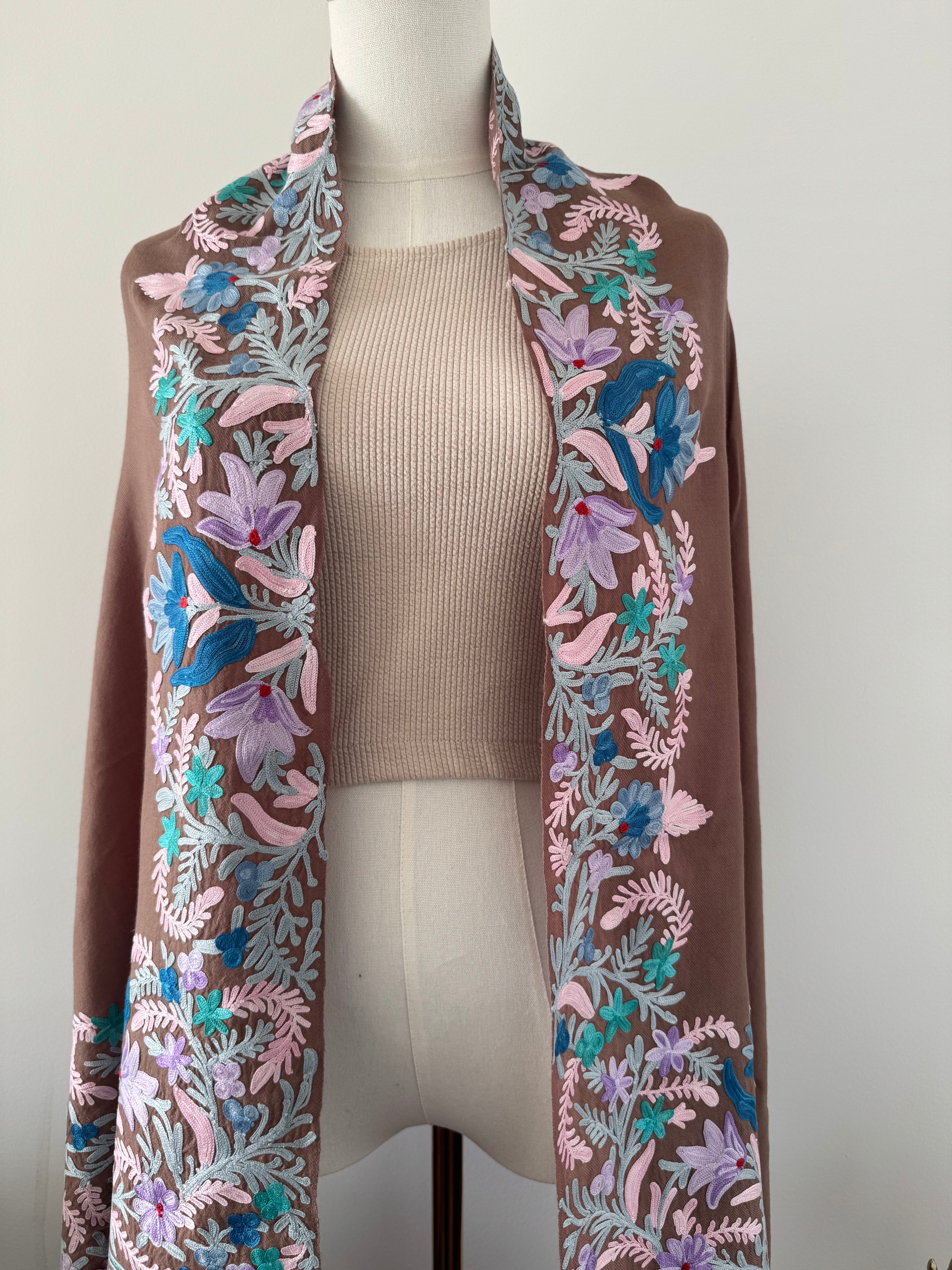 Floral-patterned fabric strip on a mannequin with a plain background