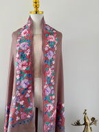 Floral embroidered stole on a mannequin with a plain background