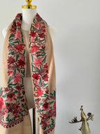 Decorative fabric with floral patterns on a mannequin against a white background