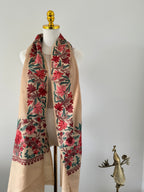 Fabric with floral patterns on a mannequin against a white background