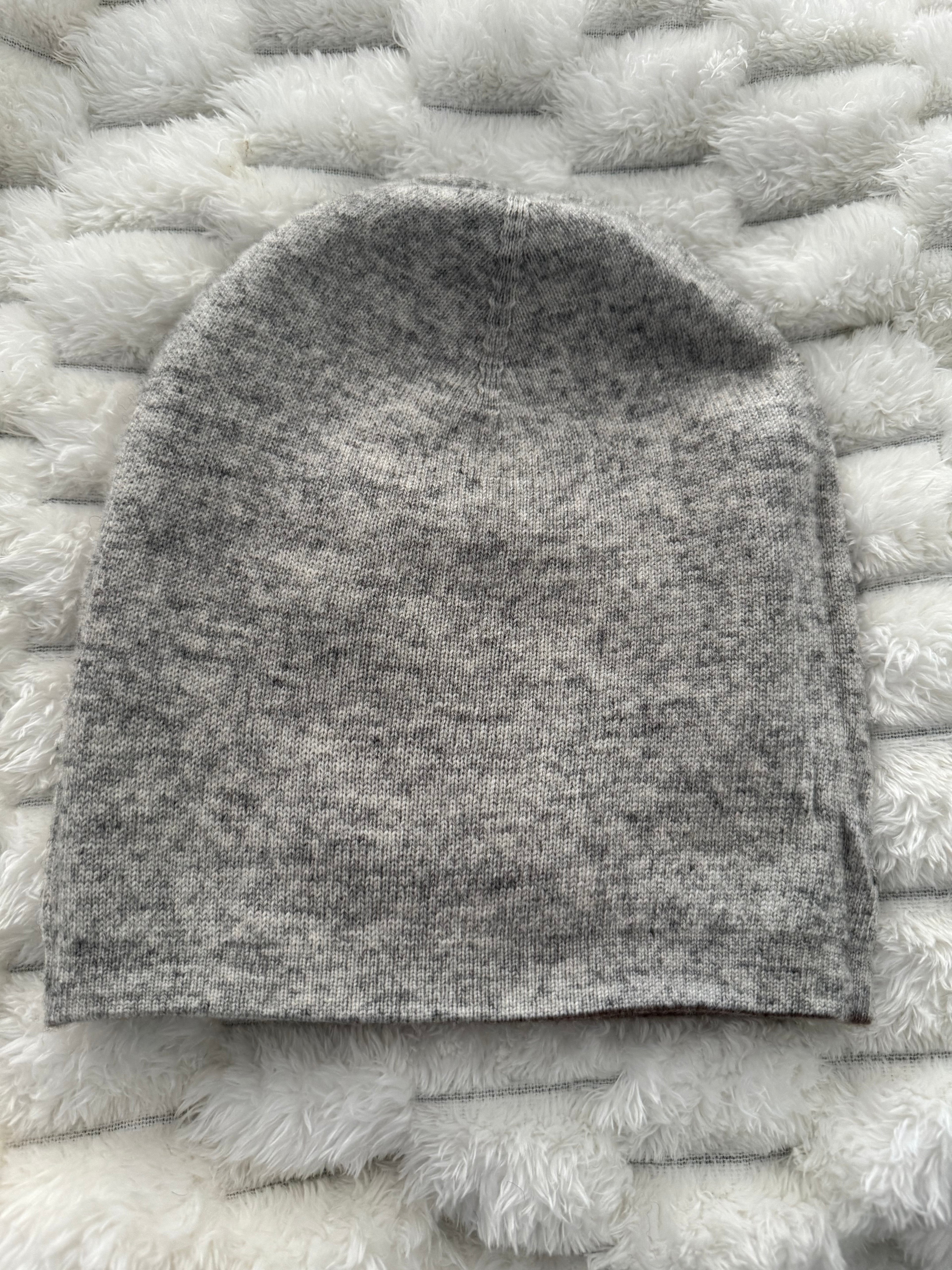 Gray textured fabric sample on a white textured surface