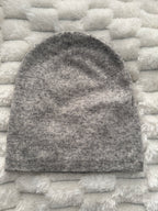 Gray sock on a textured white surface