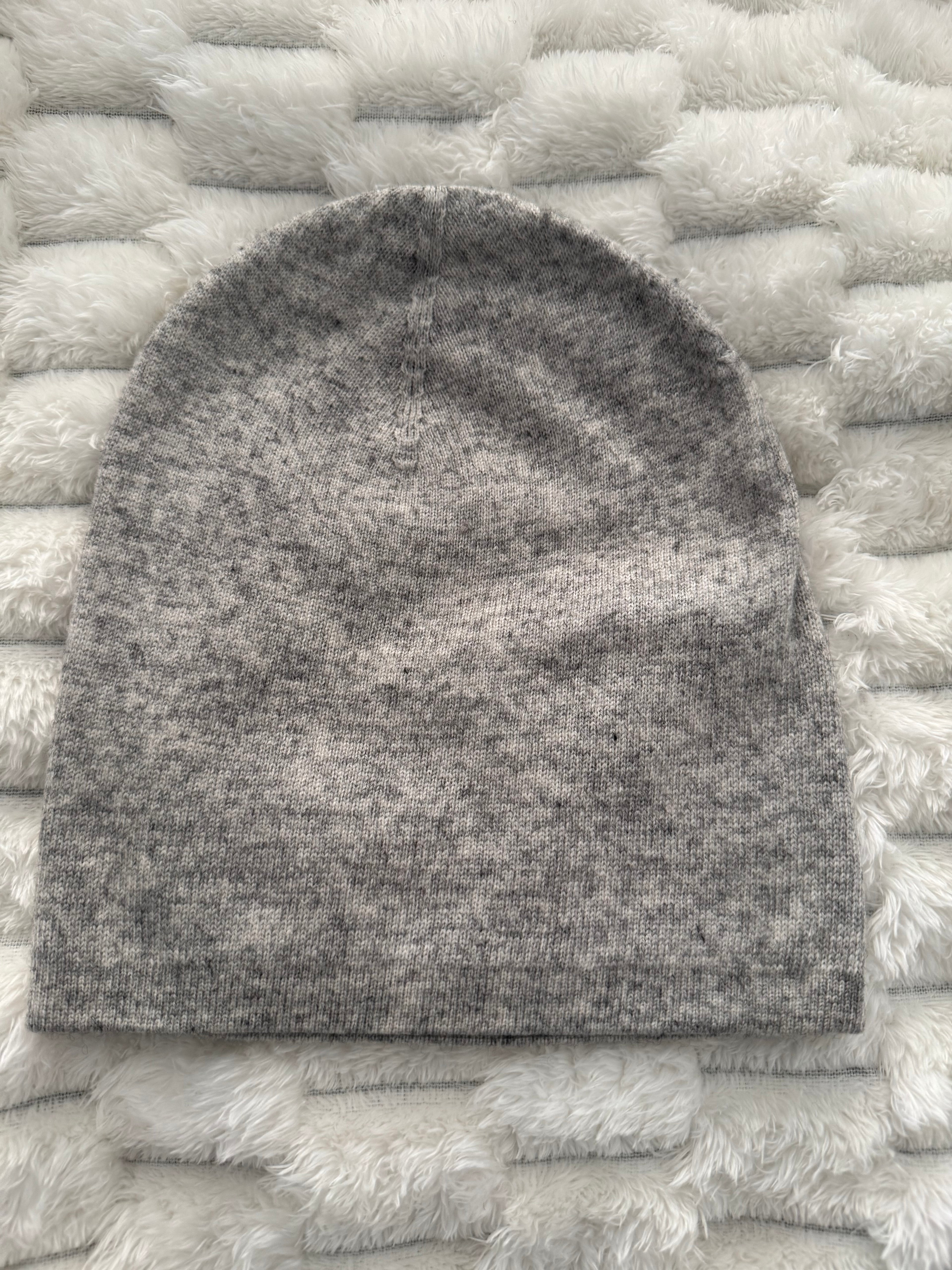 Gray sock on a textured white surface