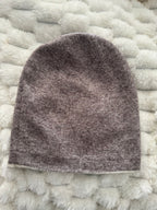 Gray textured object on a textured white surface