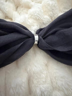 gray bow tie on a white fur background