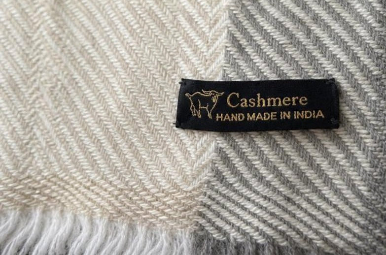 Handmade cashmere label and herringbone weave detail
