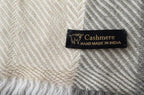 Handmade cashmere label and herringbone weave detail
