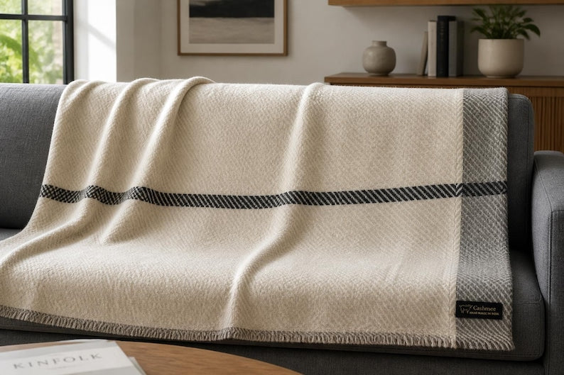 Ivory cashmere throw with grey border and accent stripe