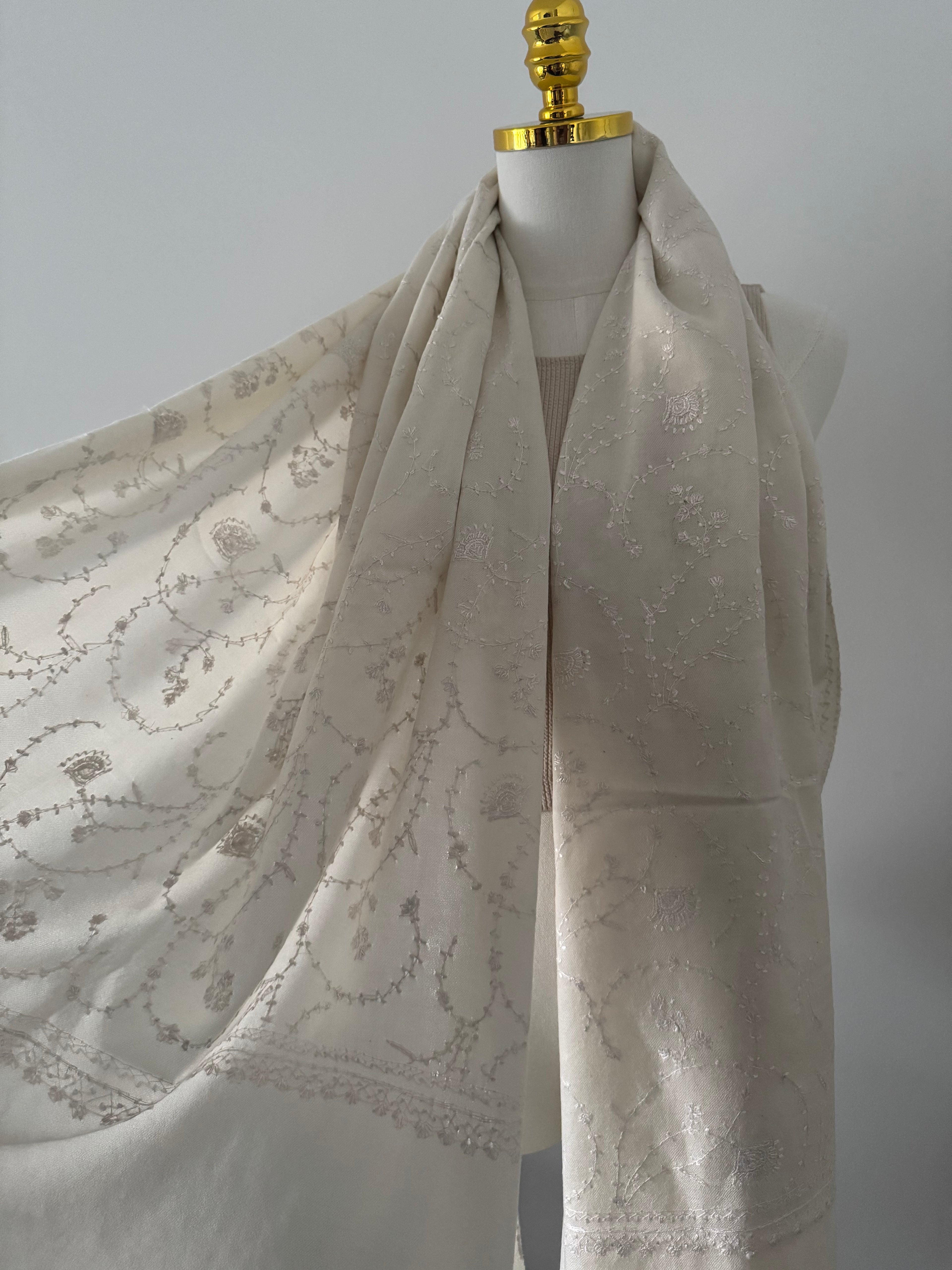 White fabric with embroidery on a white background